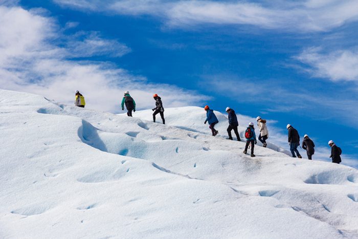 people-walking-on-a-glacier-adventure-group-perito-moreno